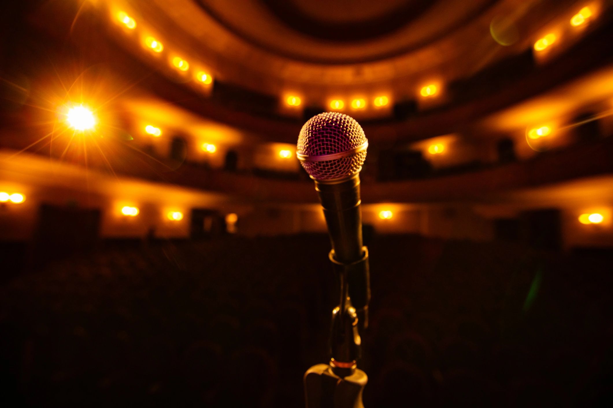 Microphone on an empty stage with spotlights