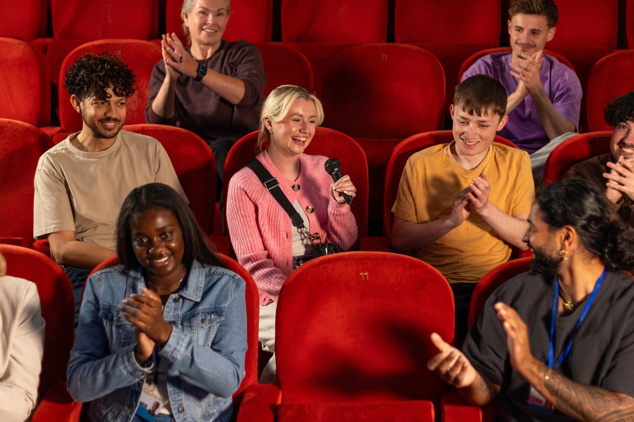 Audience engaged and smiling at a live event