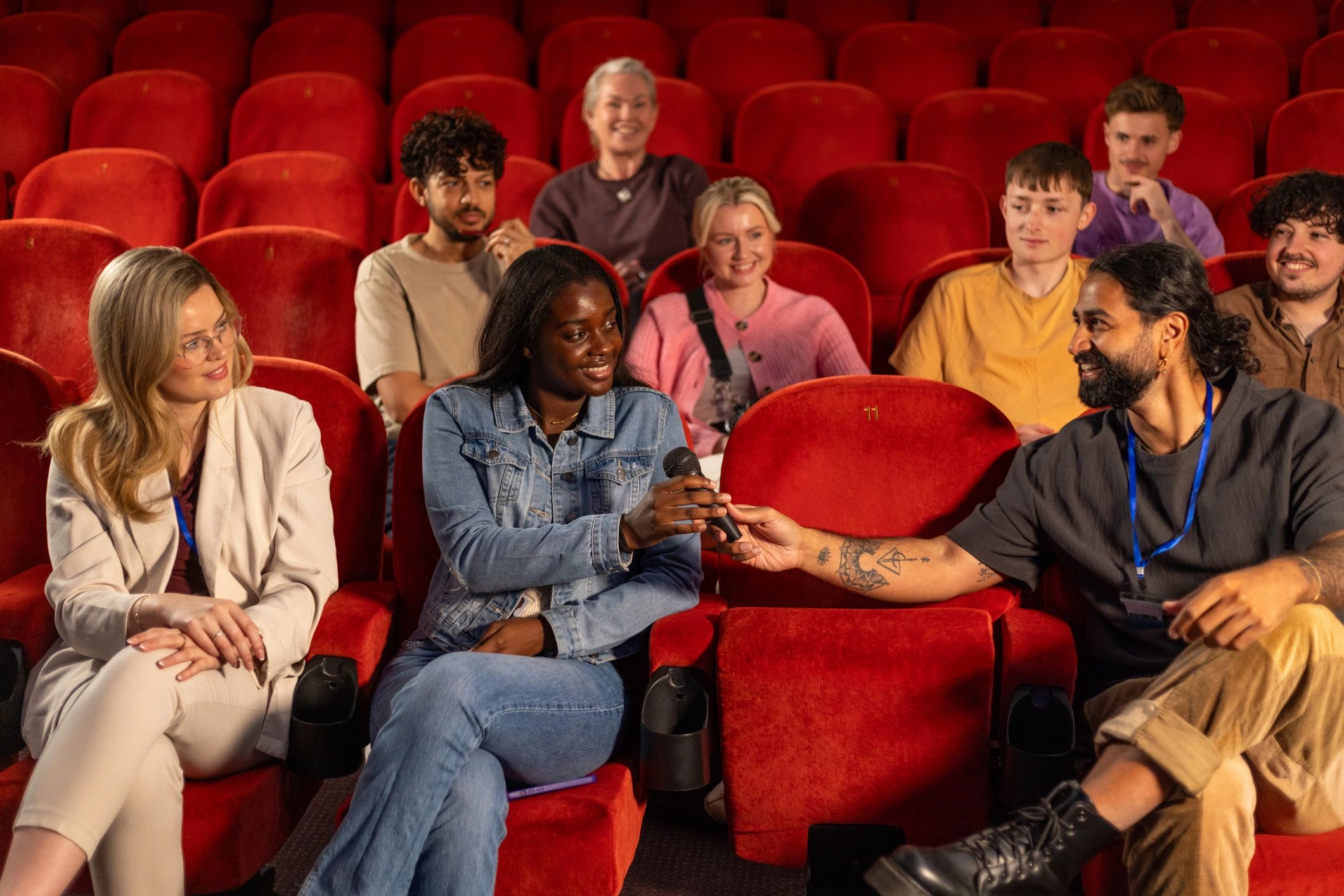 Audience participating and smiling at a live event