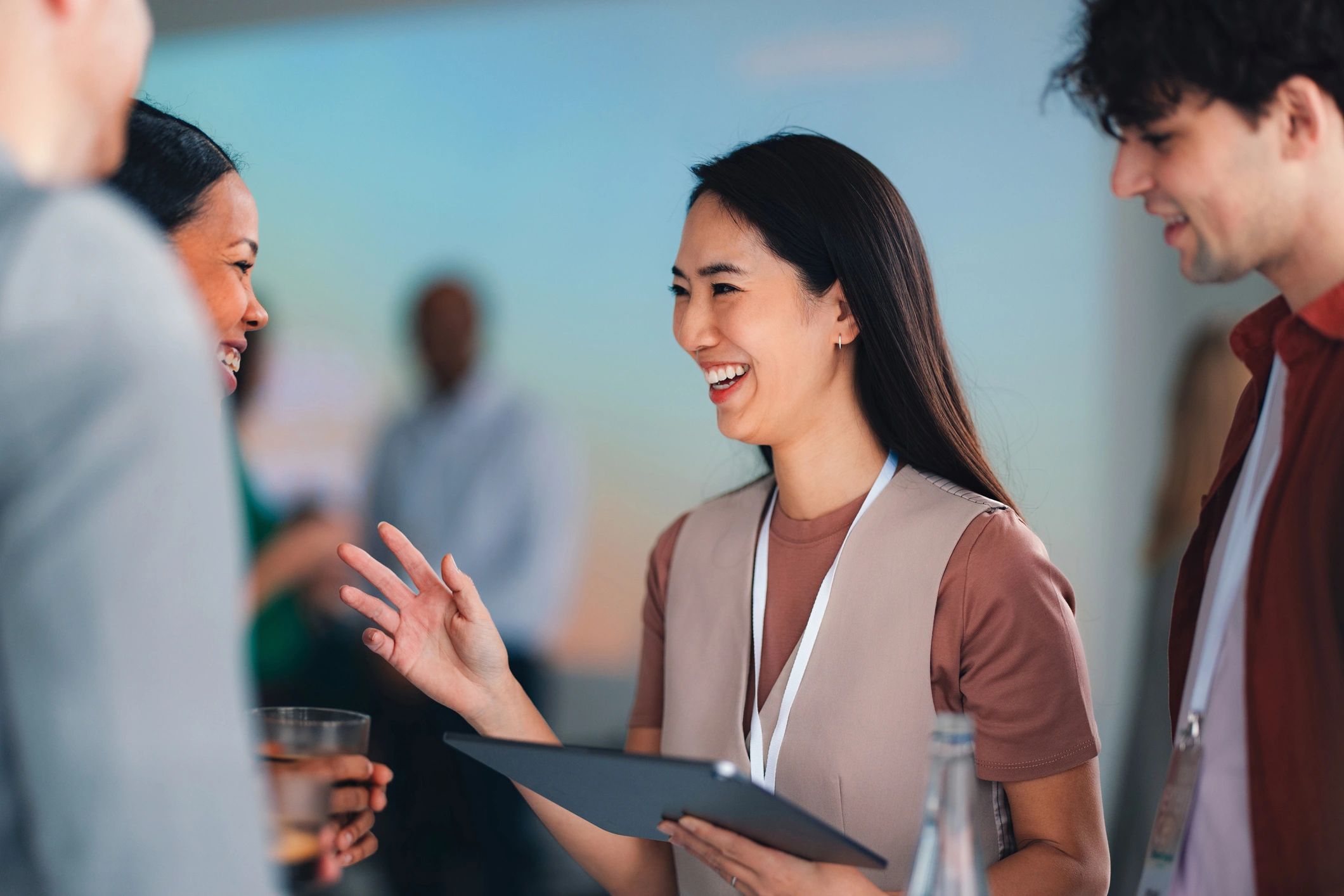 Professionals networking and smiling at a conference